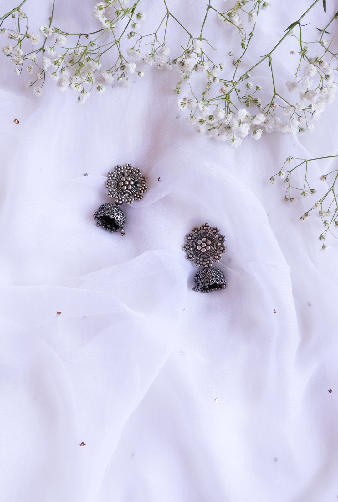 Floral Black toned Oxidised Jhumkas